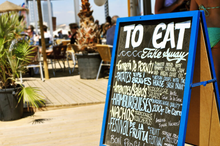 closeup of the chalkboard menu of a restaurant in Barcelona, Spain, with different catalan and spanish dishes